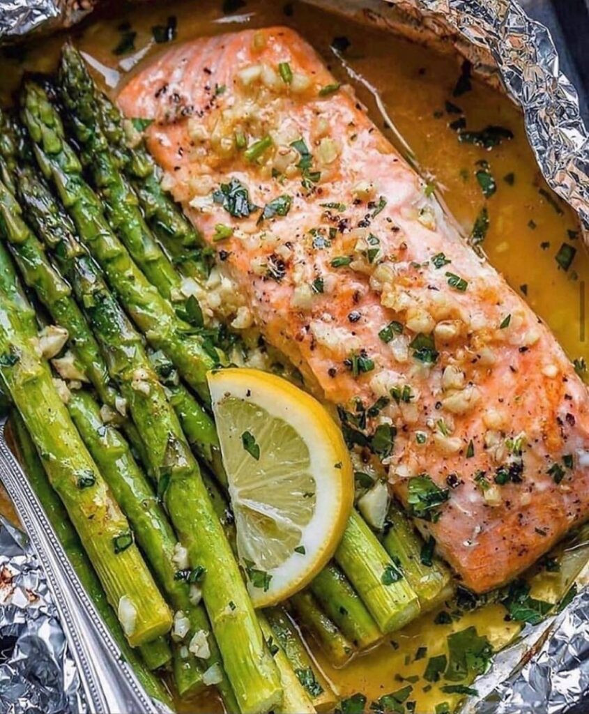 Salmon and asparagus In Foil Fresh Baked Salmon and asparagus In Foil with Lemon Garlic